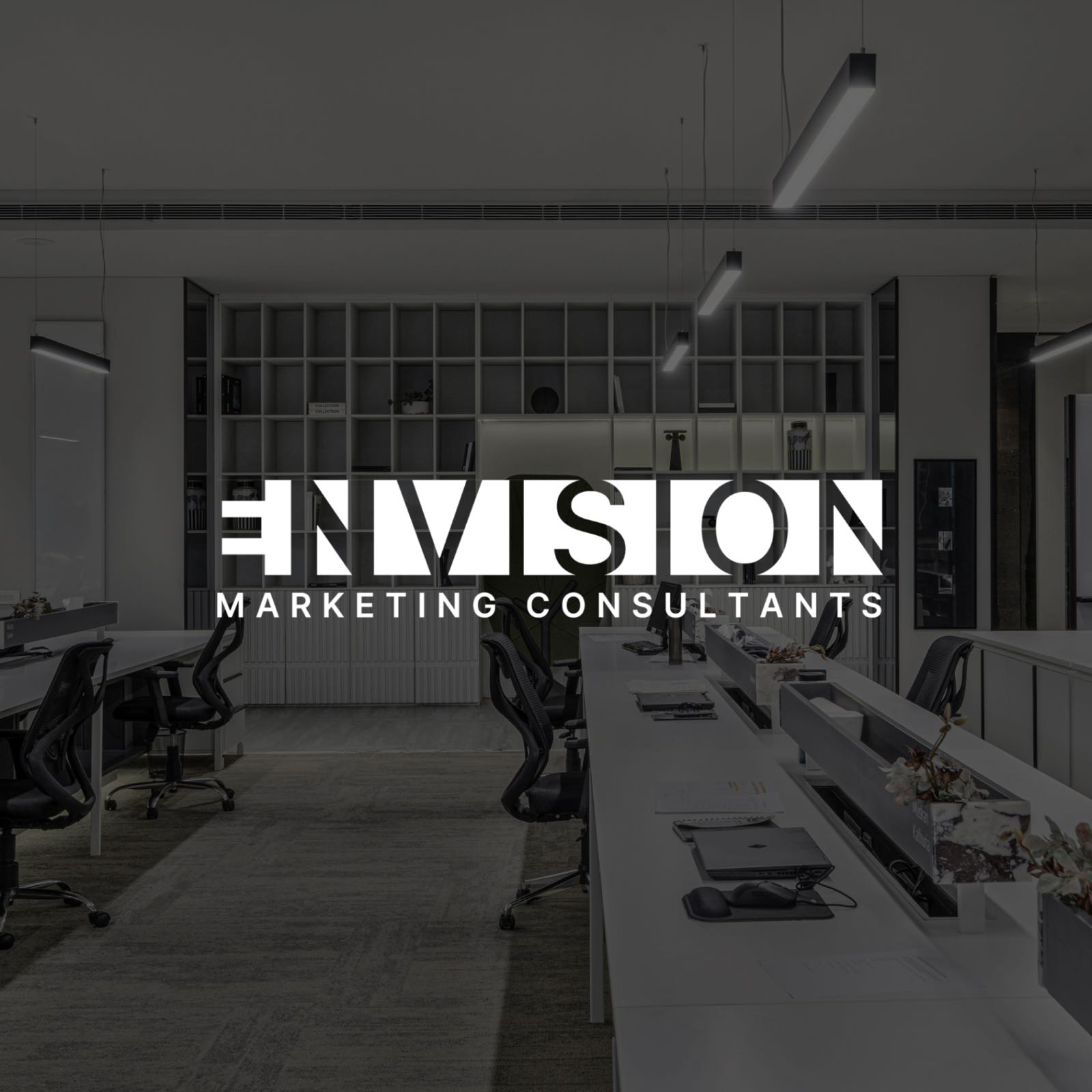 Envision Marketing Consultants brand identity in a modern office