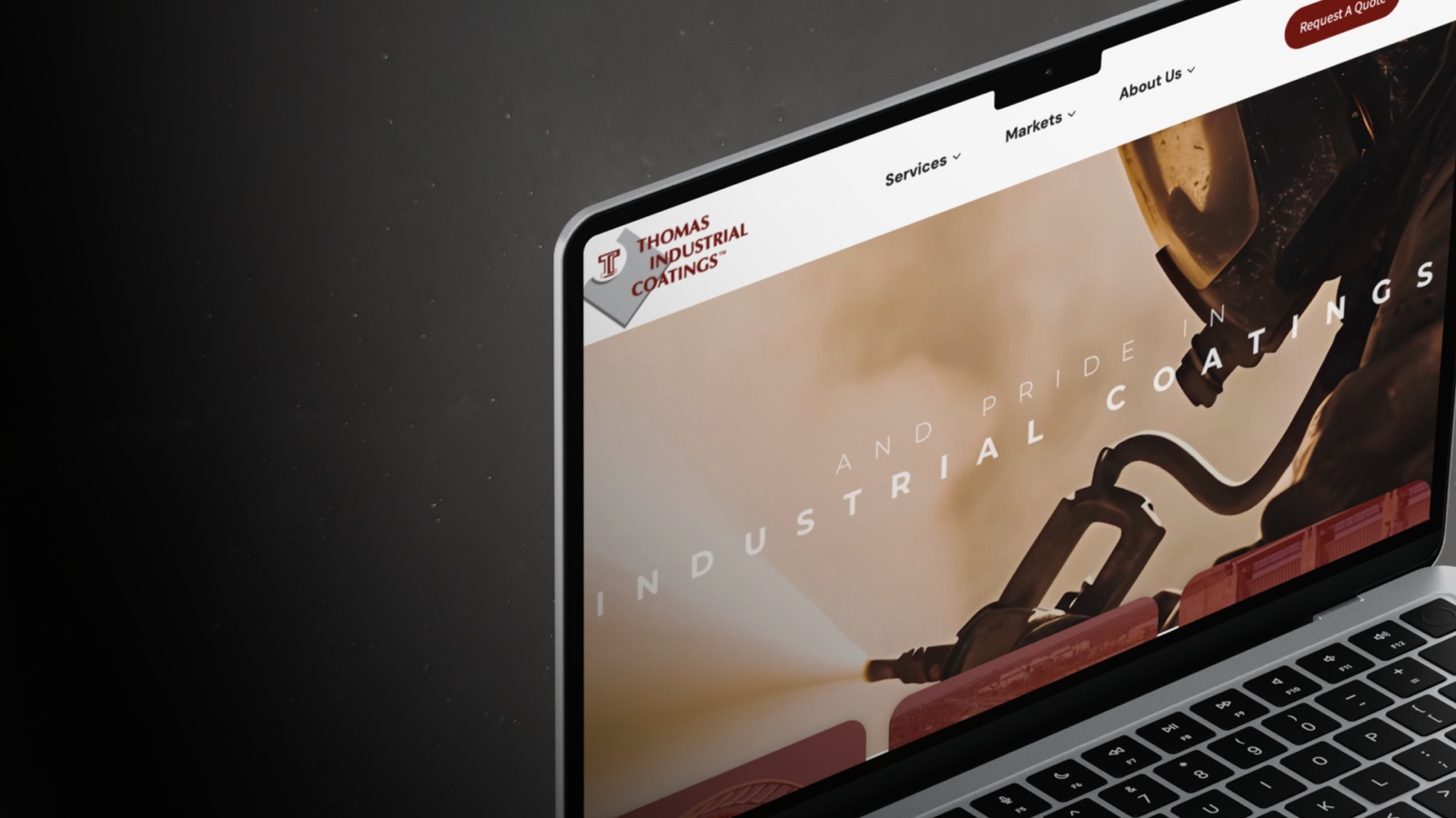 Thomas Industrial Coatings website on laptop